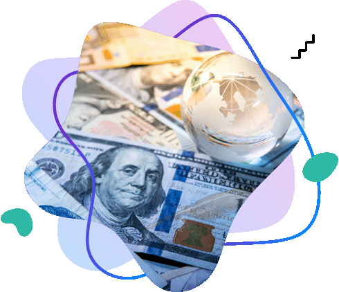 Szklany globus leżący na&nbsp;banknotach dolarowych, symbolizujący handel międzynarodowy i&nbsp;globalne finanse.